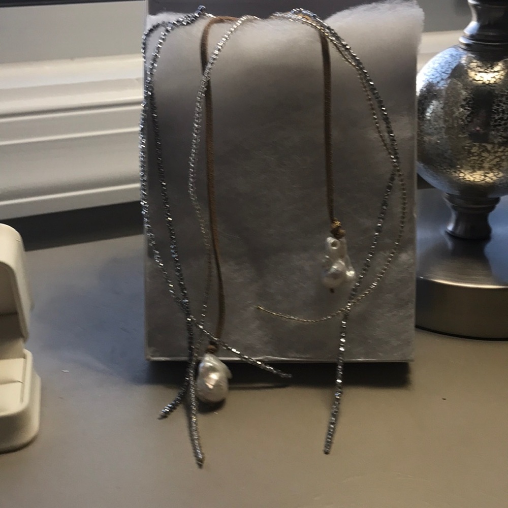 Handmade cabachon white pearls on leather/beads